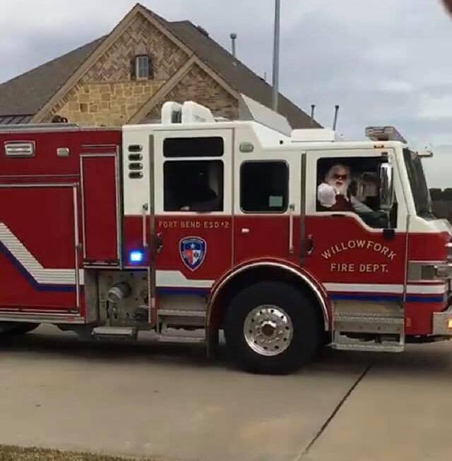 Sugar Land Santa arriving in Fire Truck